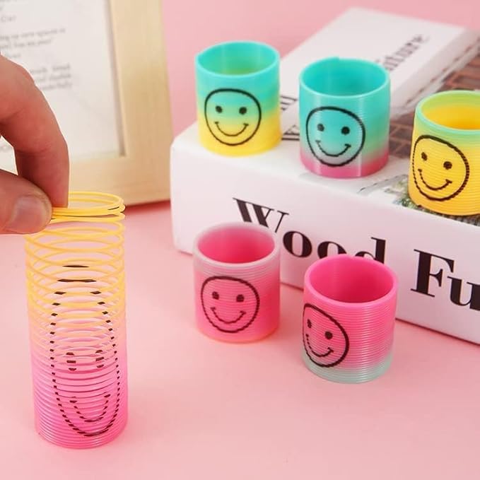 72 PCS Mini Emoticon Smile Happy Face Rainbow Springs Party Favors in Storage Bucket - Bulk Set of Plastic Magic Coil Stretch Stress Toys for Kids Birthdays, Carnival Prizes, Goodie Bag Stuffers