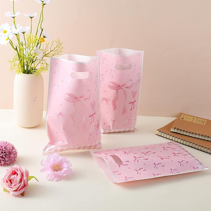 QfwdfcTrenz 50 Pcs Pink Bow Plastic Gift Bags, Goodie Dags with Handles Light Color Bow Themed Party Candy Favor Bag for Birthday Bridal Engagement Party